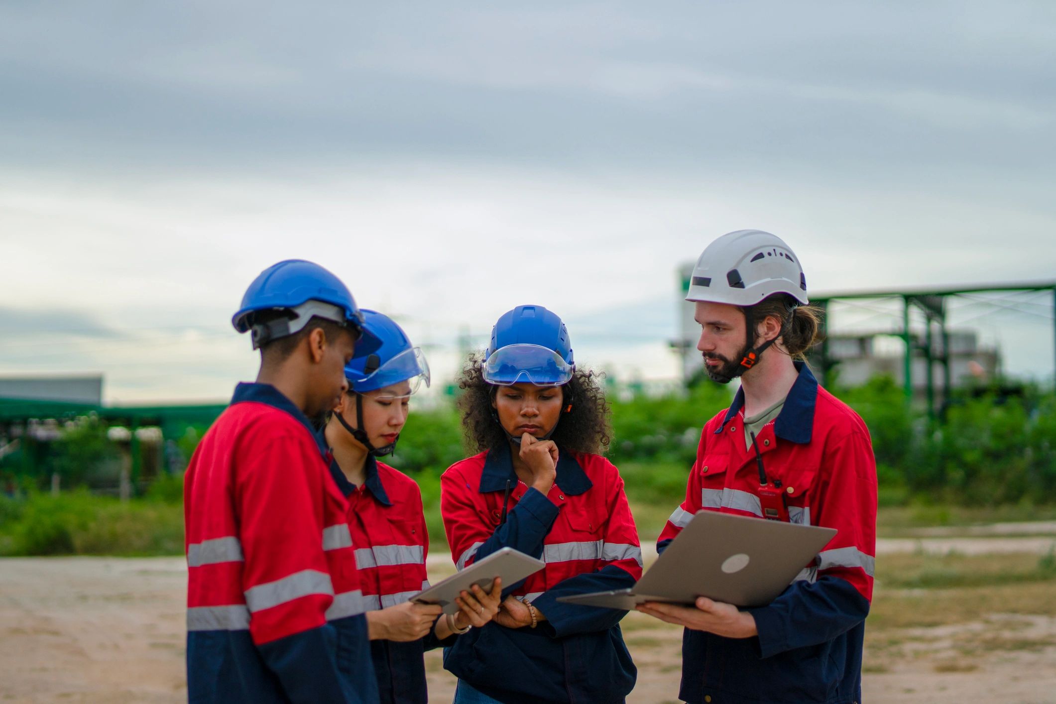Operations team working together at an industrial maritime service site
